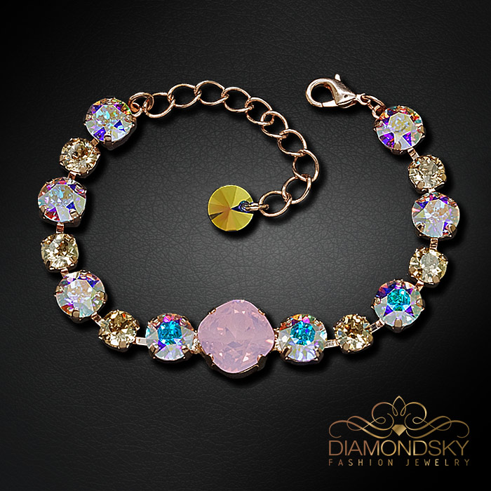 Aproce „Apžilbinošs Mirdzums II (Rose Water Opal / Aurora Borealis / Golden Shadow)“ ar Swarovski™ kristāliem